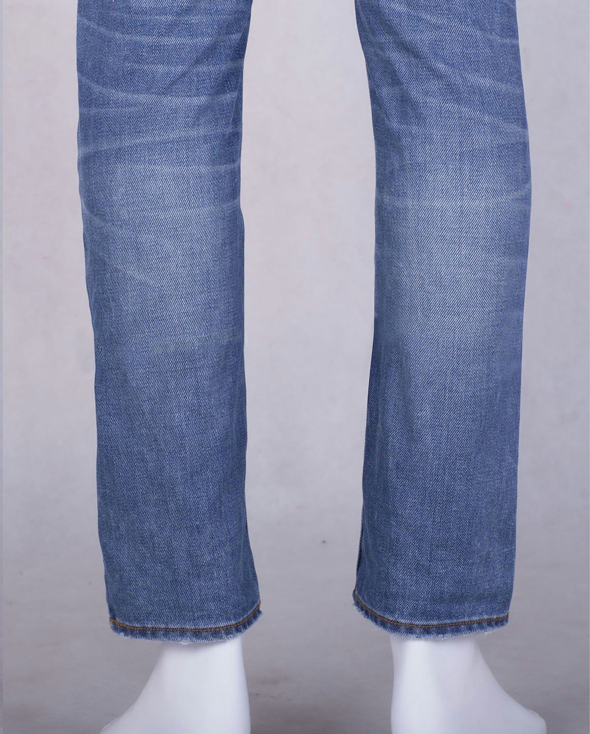 jeans-retouching-pinning-crease-removal-after Retouched product image showing jeans striking at mannequin ankle